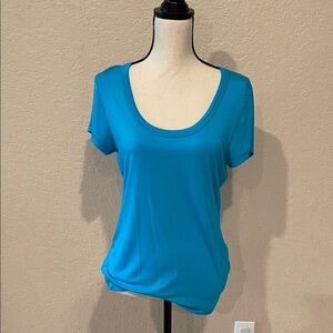 Light blue casual top. Scoop neck.